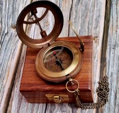 Brass Pocket Compass Displayed on Wooden Box